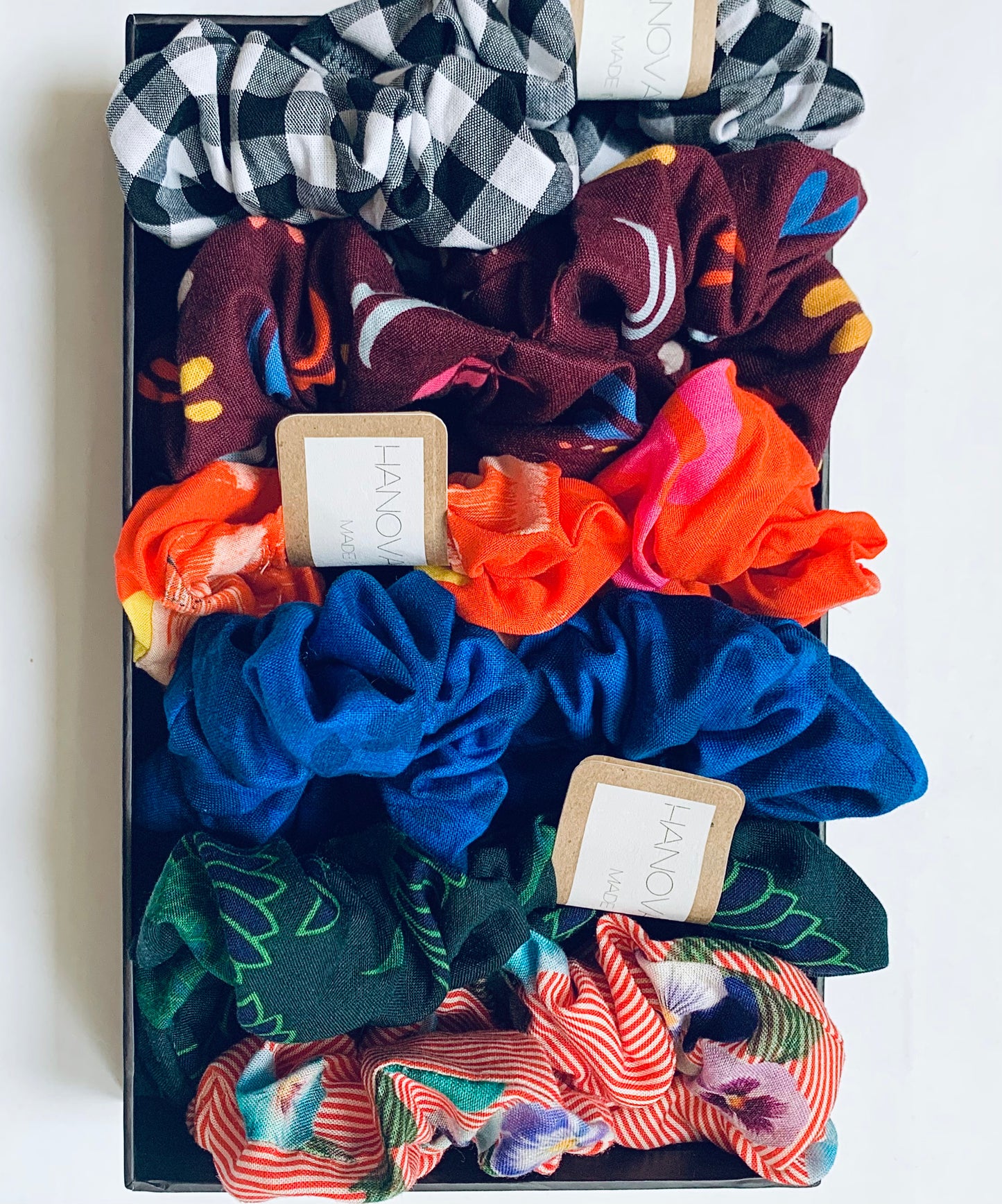a box of colourful zero waste hair scrunchies