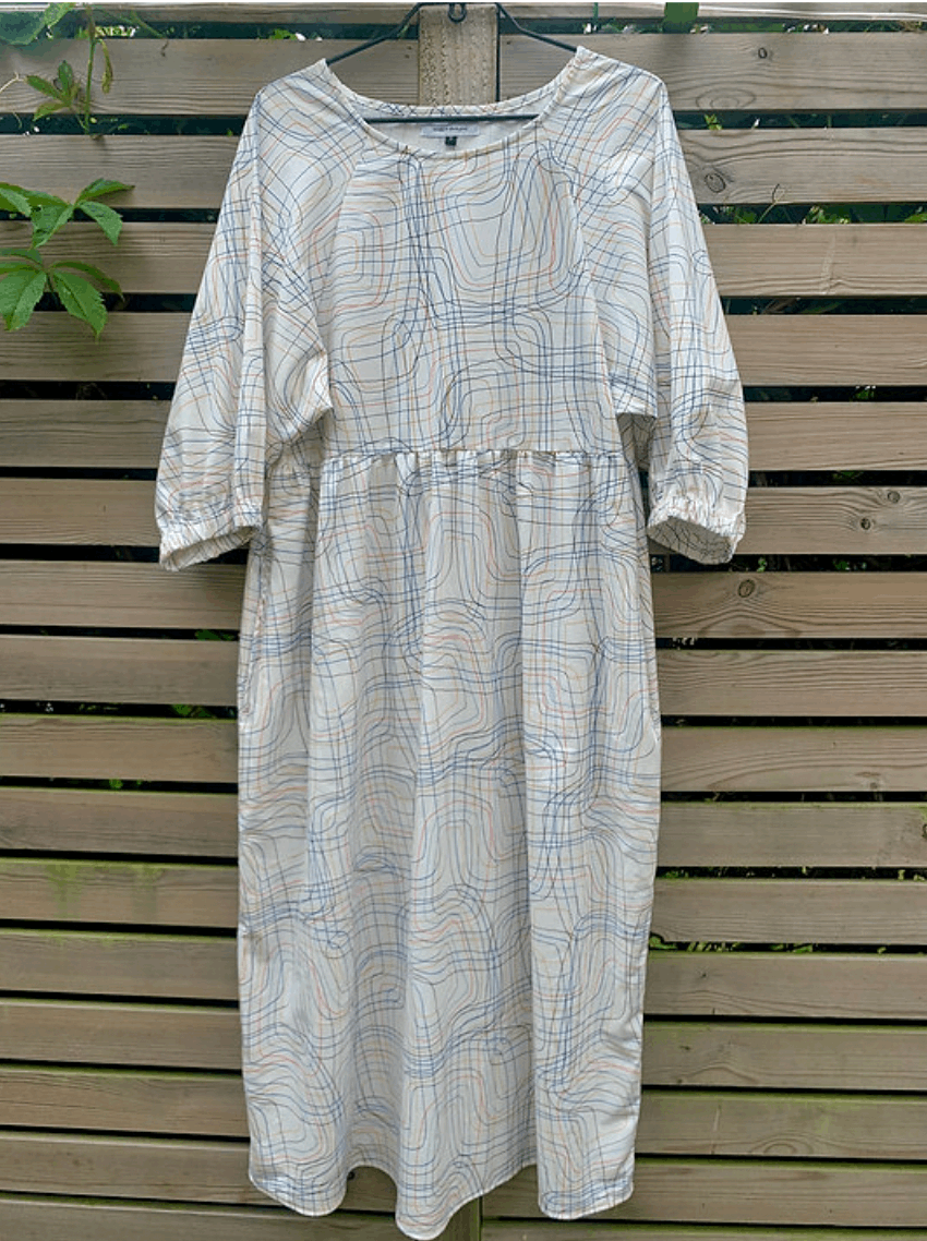 Kay Dress in Cream Ley Lines Cotton on a hanger