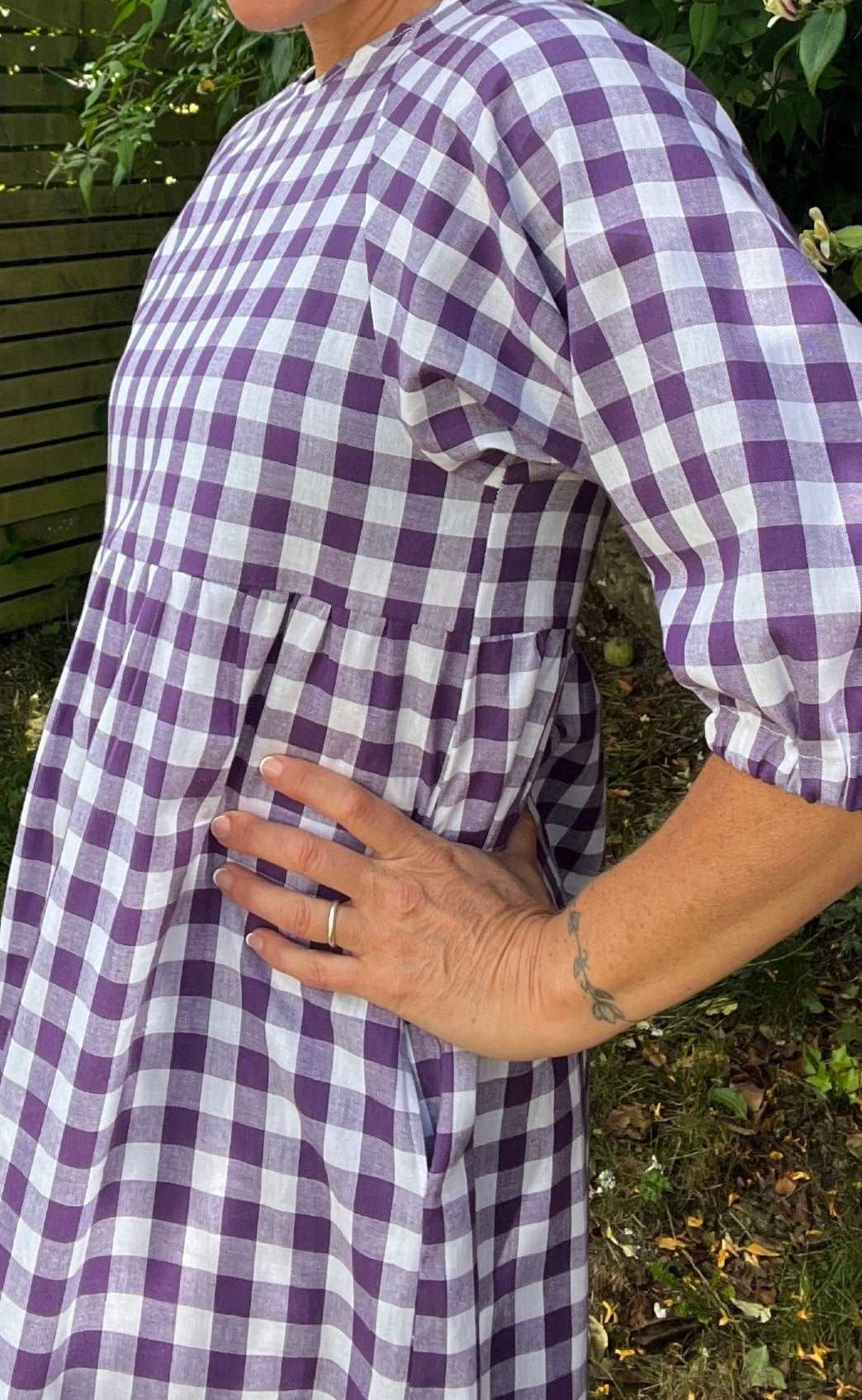 close up side view of purple gingham Kay dress sustainable dresses UK