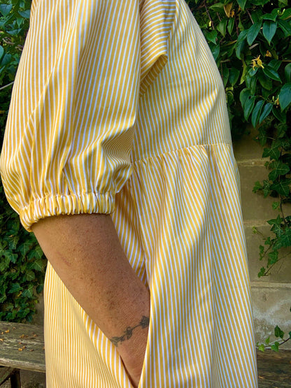 Side close up of Kay dress yellow strip kay dress