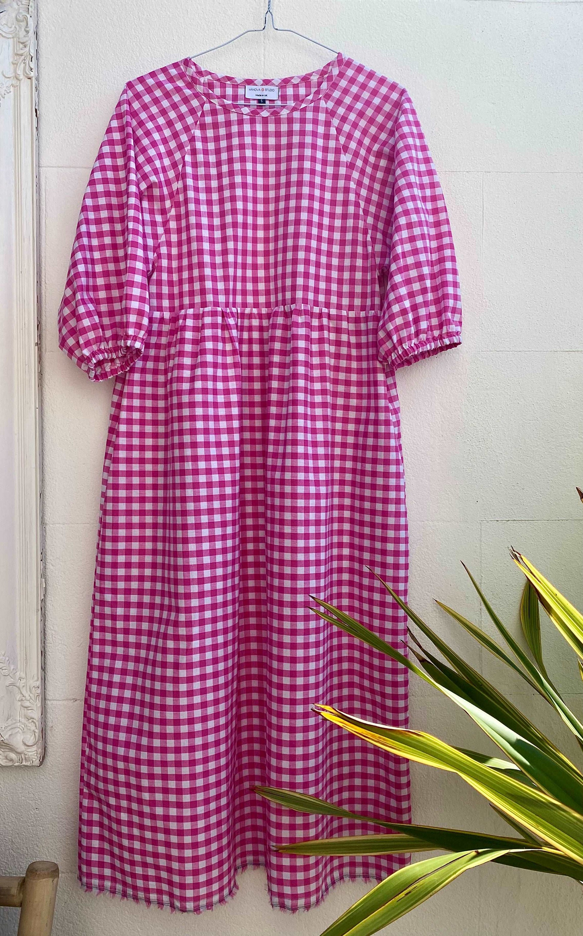 Kay dress in pink gingham on hanger sustainable dresses UK