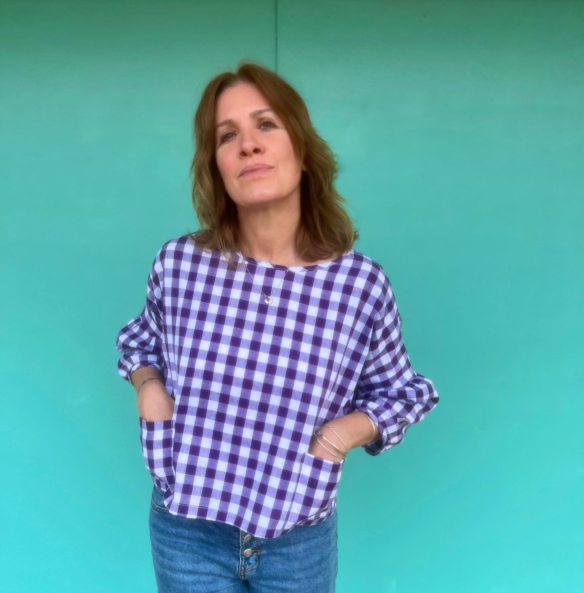 wearing the purple gingham cloud blouse hands in pockets