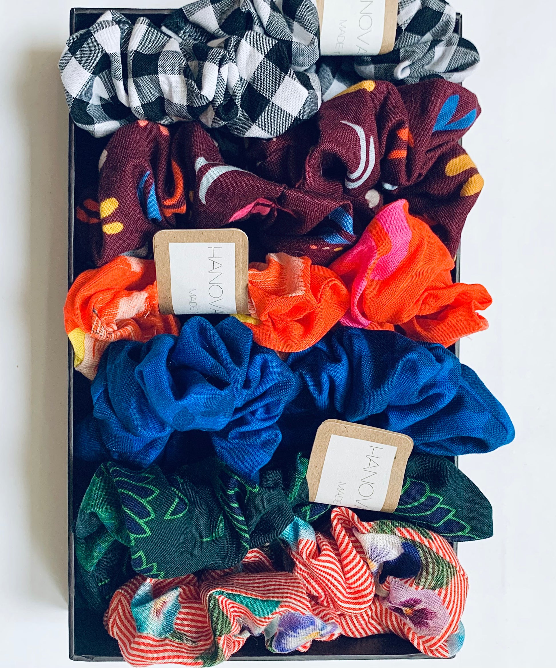 a box of colourful zero waste hair scrunchies