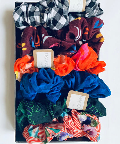 a box of colourful zero waste hair scrunchies