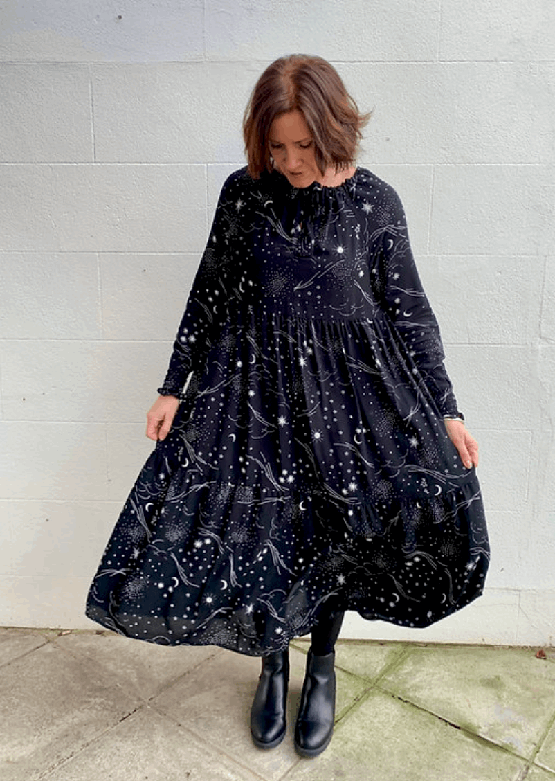 night sky fabric nova gown holding skirt out sustainable dresses UK