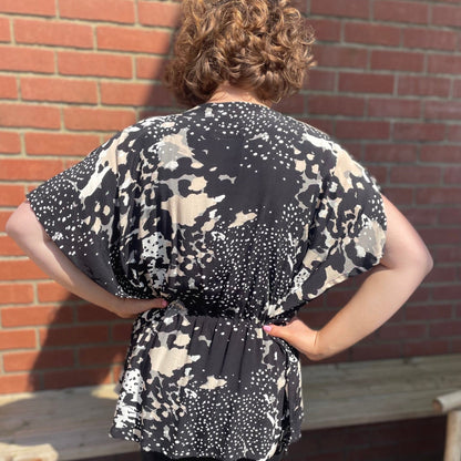 Back view of model wearing neutral print made to order Angel Top by Hanova Studio