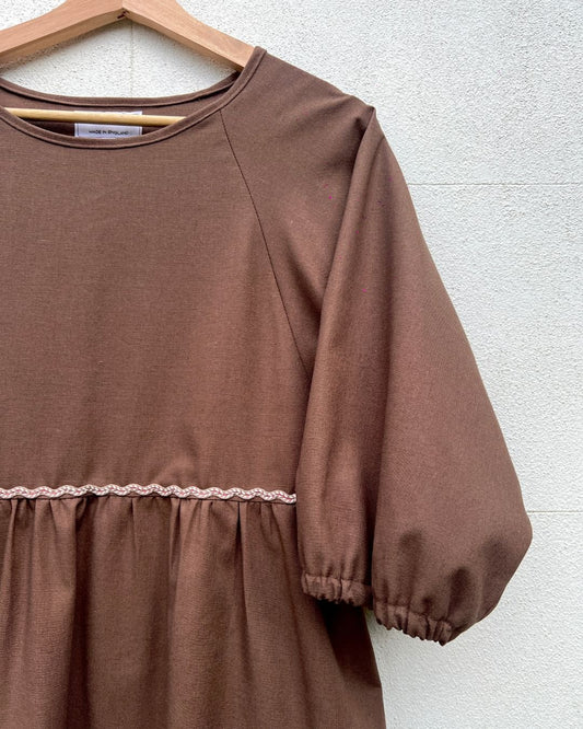 Close up of Kay Dress in brown linen mix with ric rac embellishment
