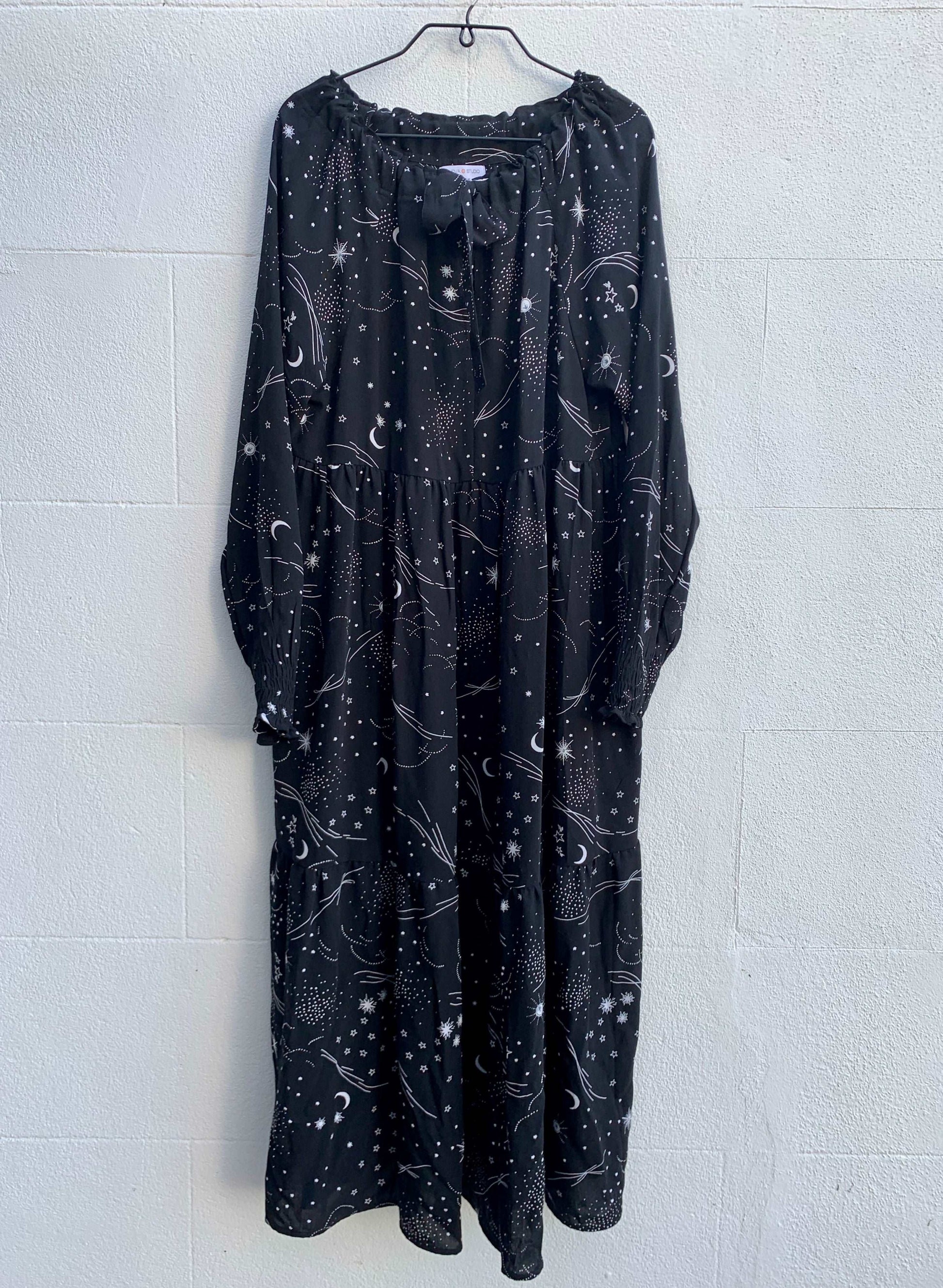Nova Gown in Night Sky on a hanger sustainable dresses UK